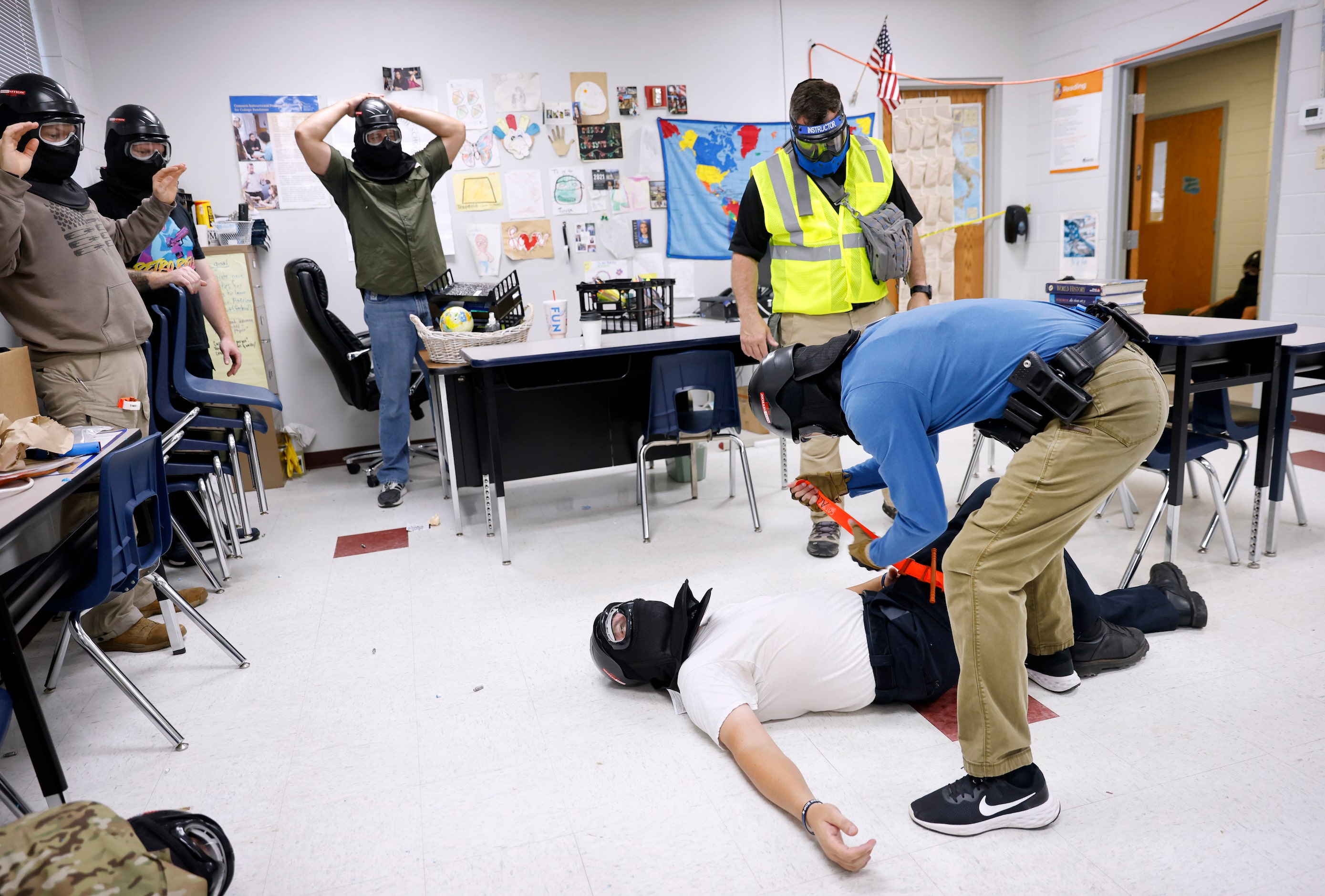 Advanced Law Enforcement Rapid Response Training instructor Will Mercado observes Henderson...