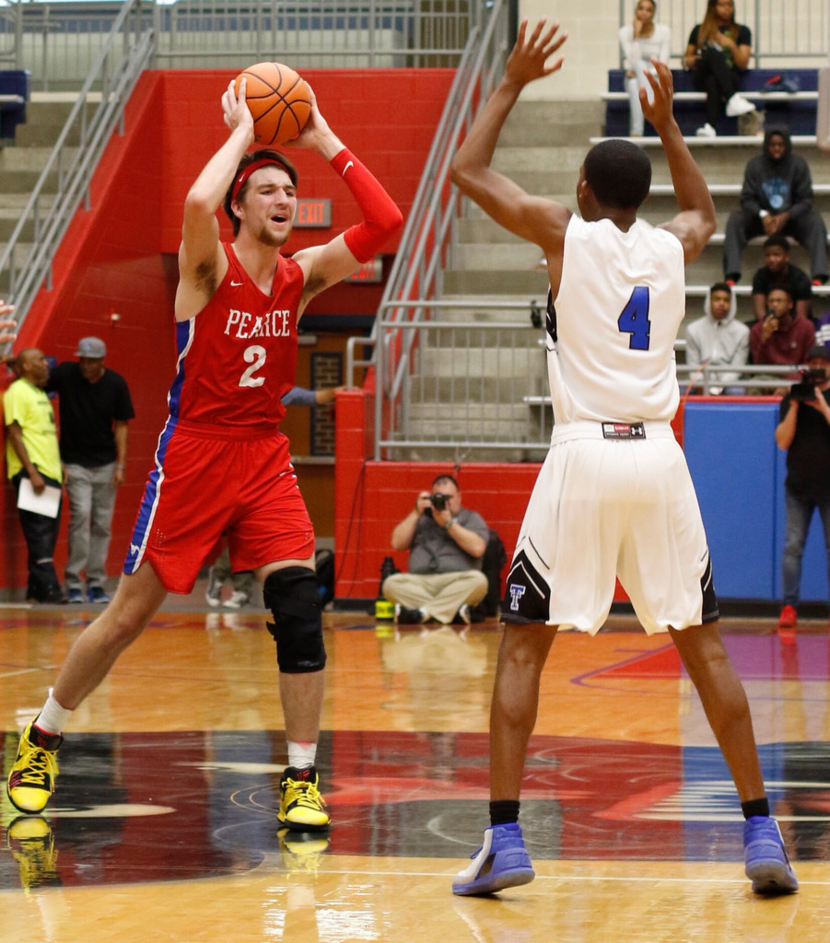 Richardson JJ Pearce post Drew Timme (2) looks to pass as Trinity Christian guard Jordan Cox...