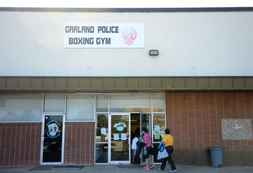 
A family enters the Garland Police Boxing Gym for the after-school boxing program.

