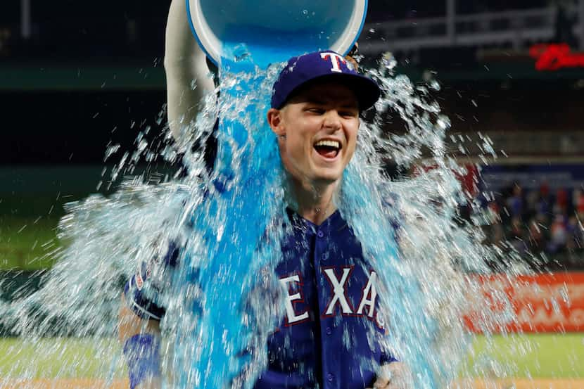 a baseball game in Arlington, Texas, Friday, Aug. 2, 2019. (AP Photo/Tony Gutierrez)