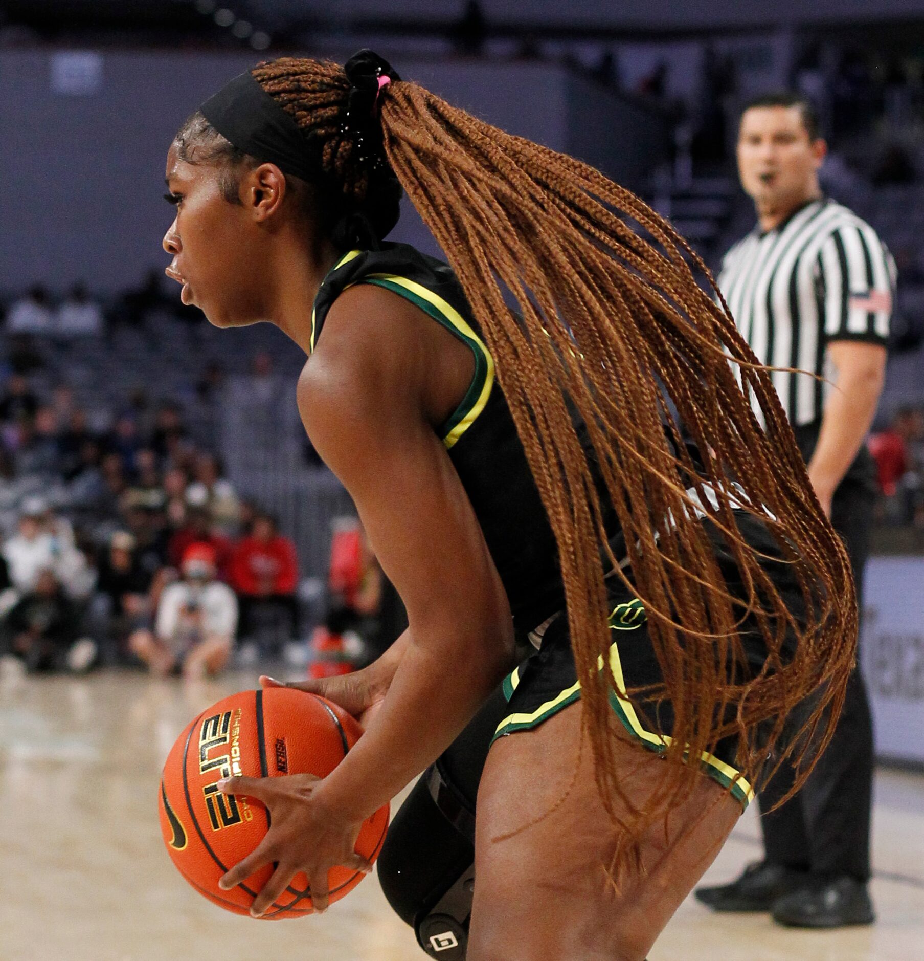 DeSoto senior Michayla Gatewood (15) looks to set up an offensive play during first half...