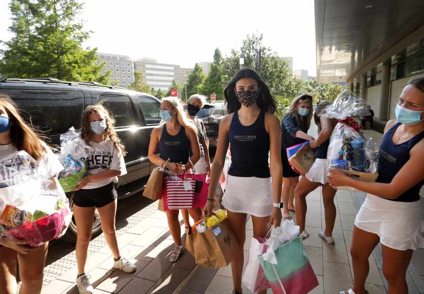 Before heading to practice, Ursuline cheerleaders drop off bags of goodies for health care...