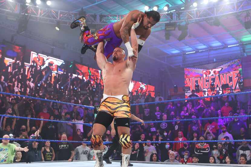 WWE NXT 2.0 star Bron Breakker lifts Santos Escobar during their match at "NXT Vengeance...