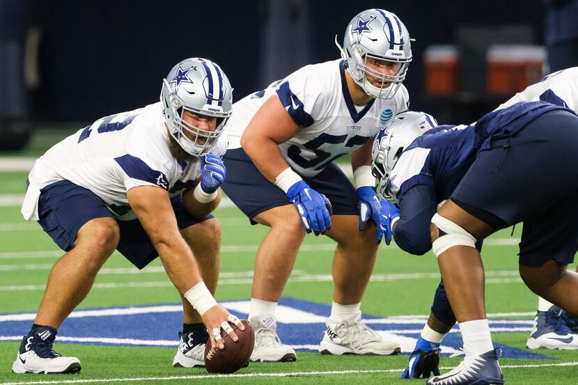 Dallas Cowboys center Travis Frederick (72) and offensive guard Connor Williams (52) line up...