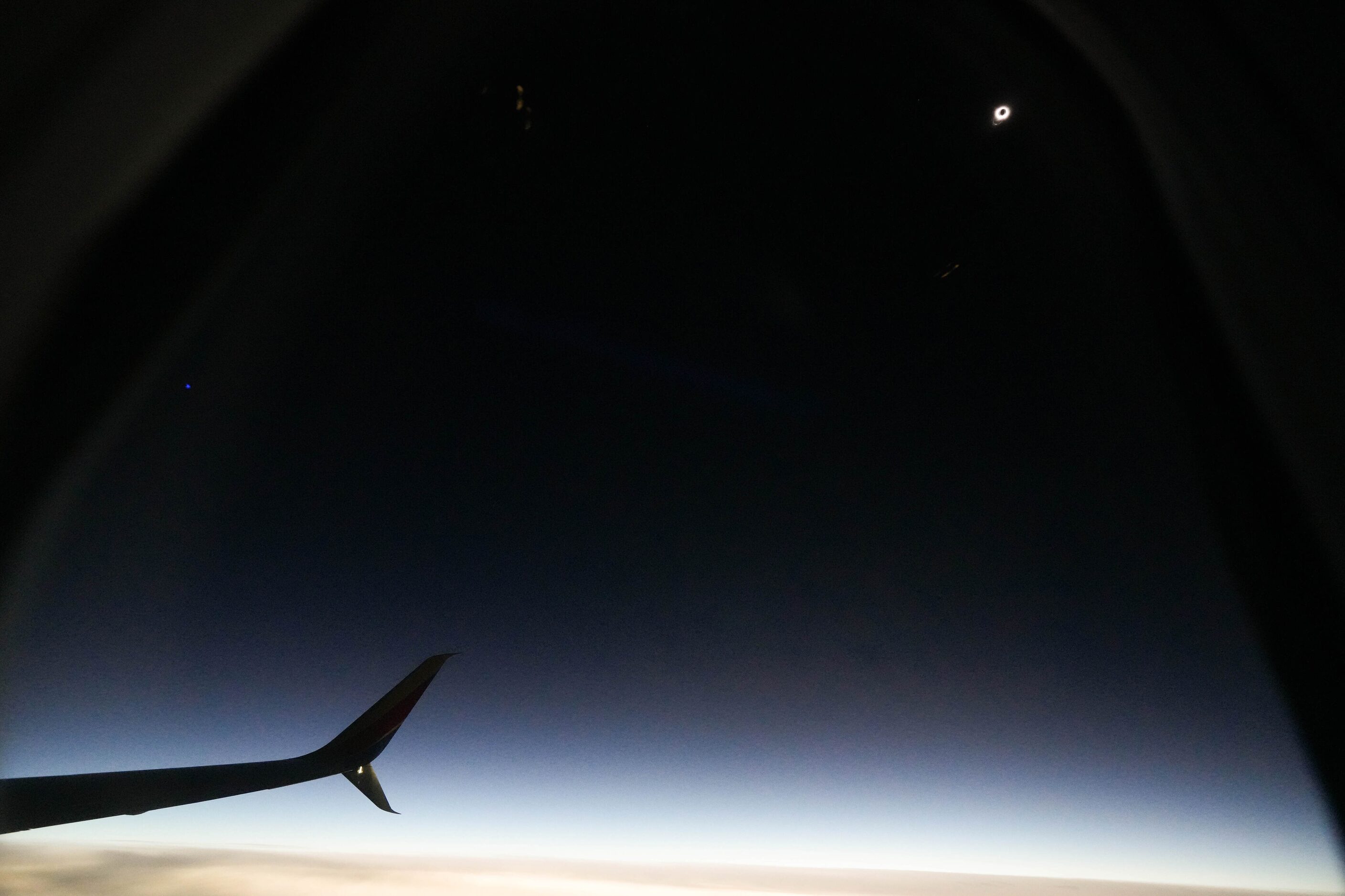 A total solar eclipse is seen from Southwest Airlines flight #1252 from Dallas to Pittsburgh...