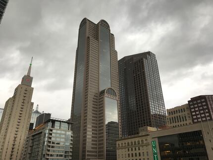 Clouds and wind hovered over downtown Dallas for a few minutes before the rains began.
