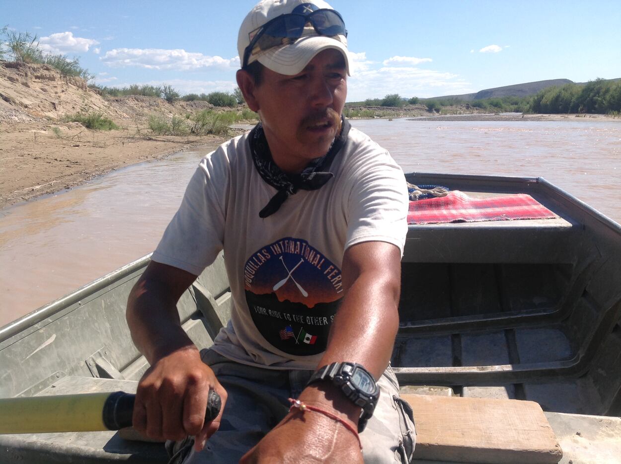Carmelo Sandoval rows the boat that ferries tourists back and forth across the Rio Grande...