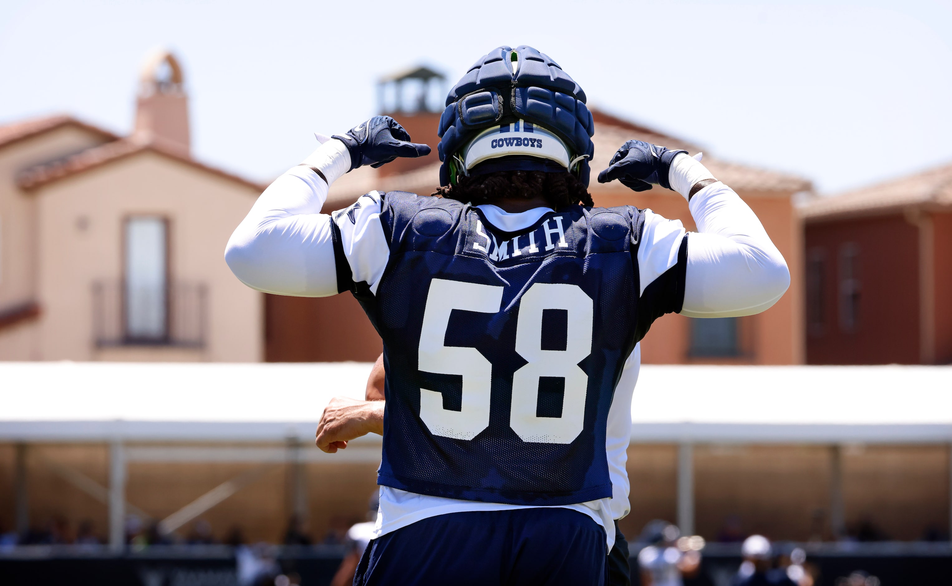 Dallas Cowboys defensive tackle Mazi Smith (58) flexes as he works out with defensive line...