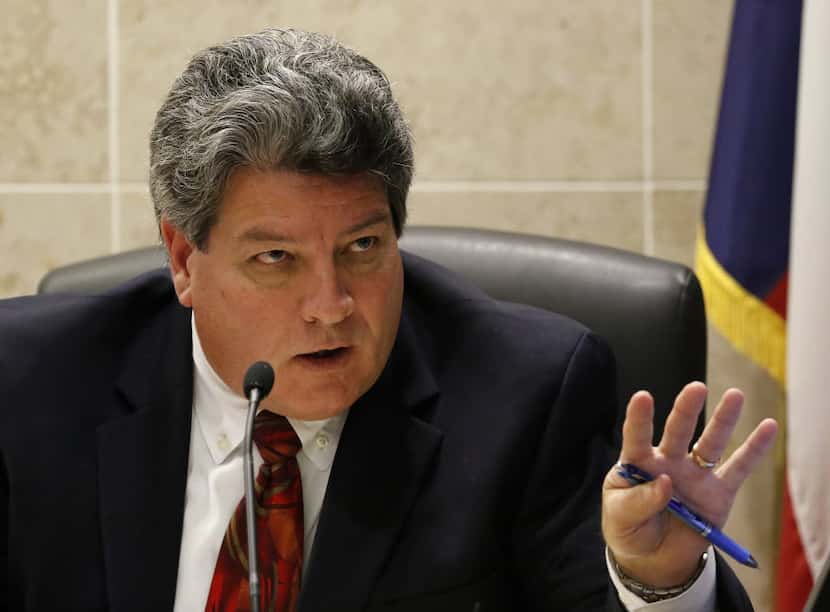 Tarrant County District Judge George Gallagher presides over Texas Attorney General Ken...