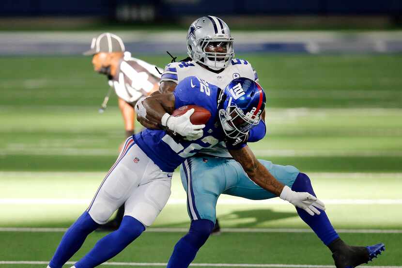 Dallas Cowboys middle linebacker Jaylon Smith (54) takes down New York Giants running back...