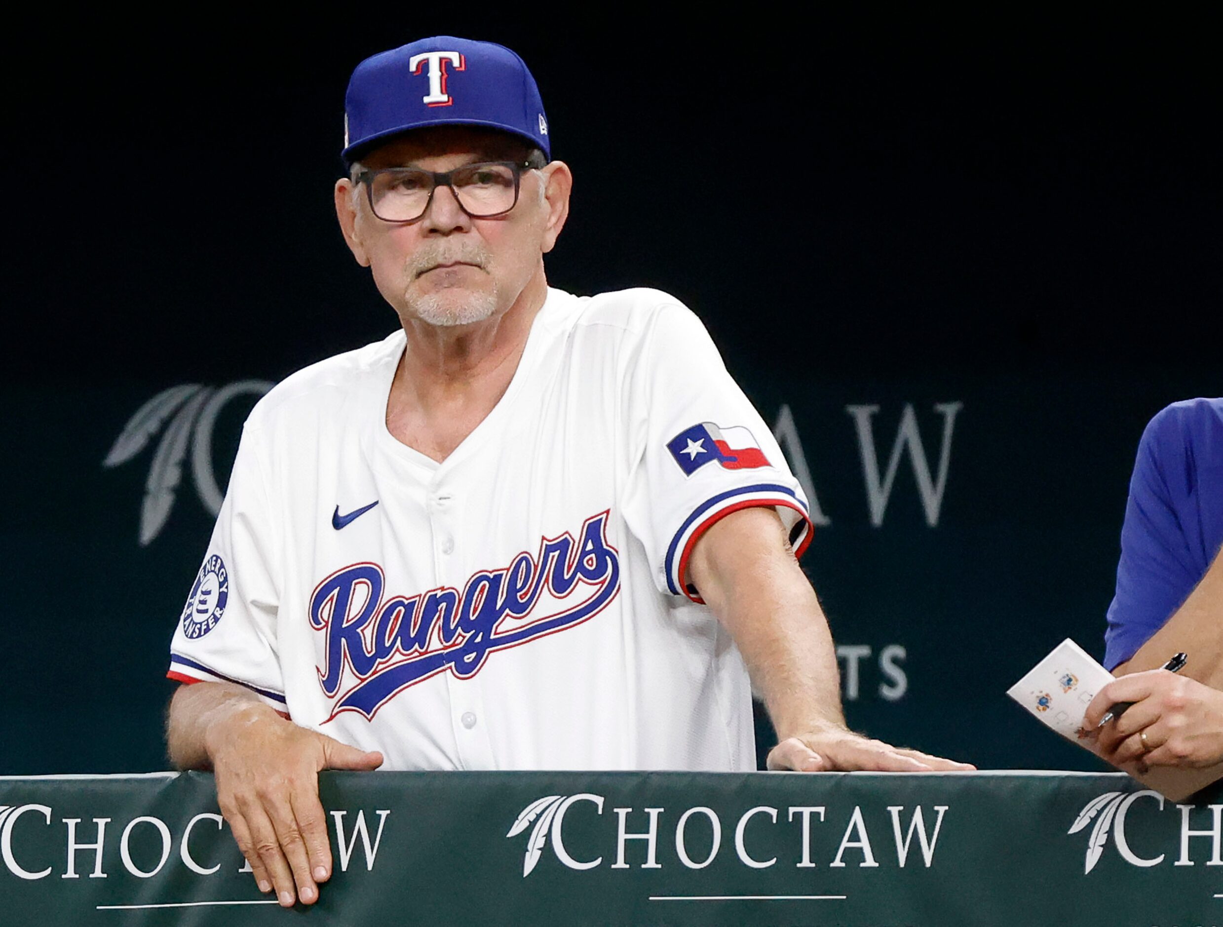 Texas Rangers manager Bruce Bochy watches his hitters at the plate as they face the...