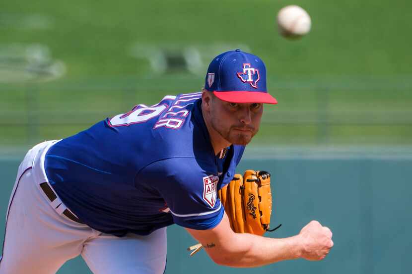 Texas Rangers pitcher Shelby Miller pitches during the first inning of a spring training...