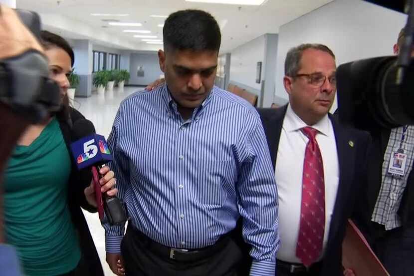 Wesley Mathews, adoptive father of Sherin Mathews, ignores questions as he leaves a court...