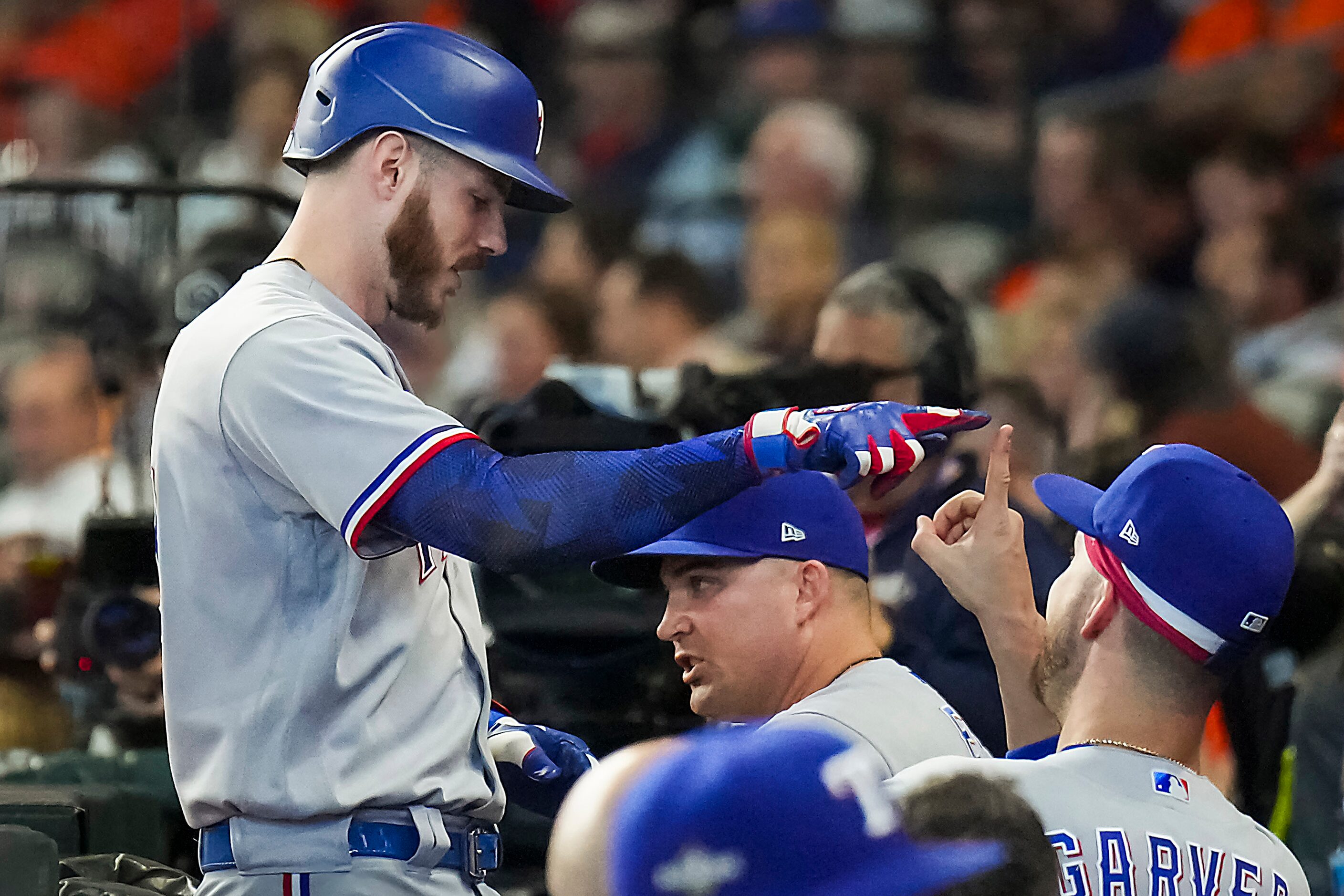 Texas Rangers catcher Jonah Heim celebrates with Mitch Garver on his way  back to the dugout...