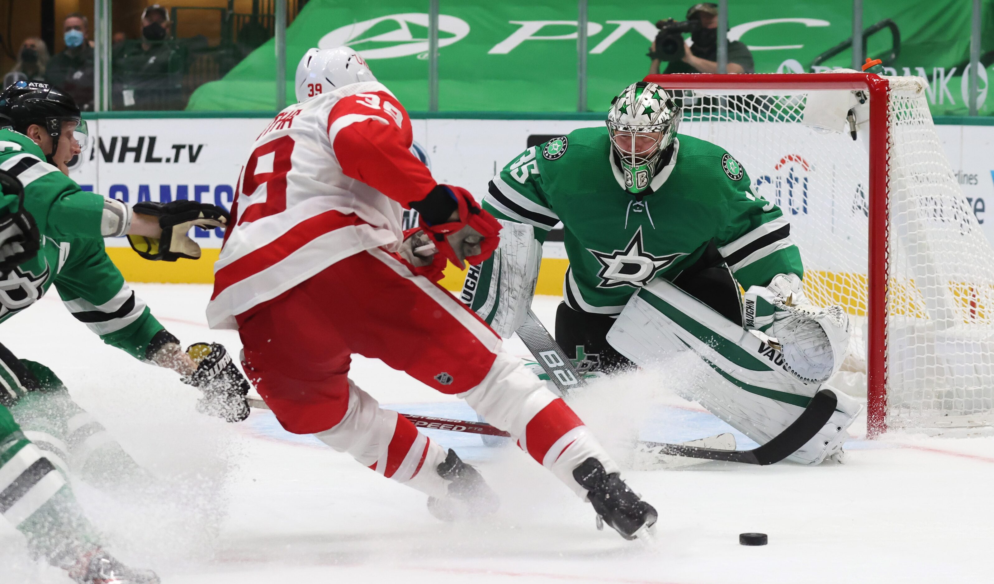 Dallas Stars goaltender Anton Khudobin (35) defends the goal as Detroit Red Wings right wing...