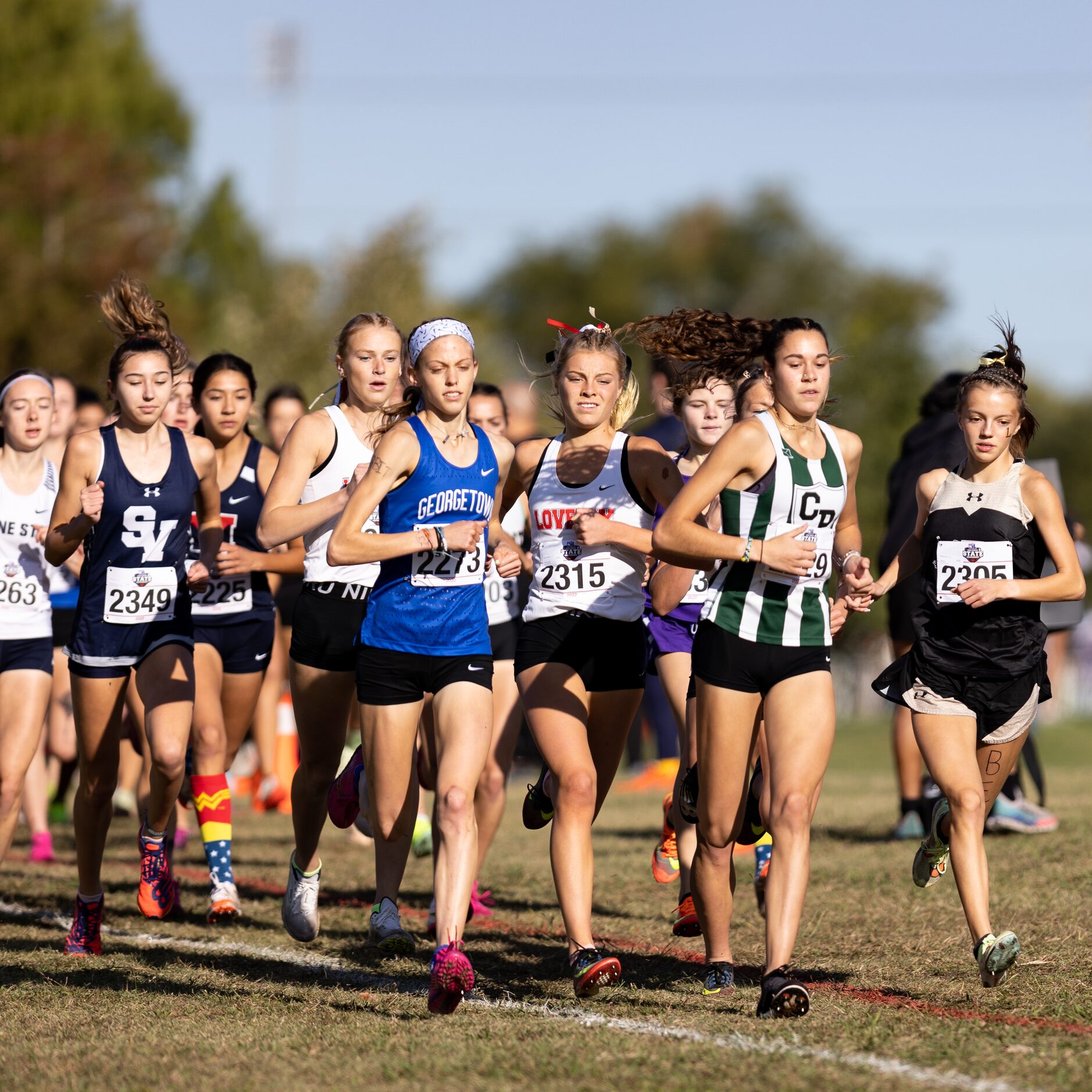 Sara Morefield of the Lovejoy Leopards runs among the leaders of the 5A girls' 3200m race...