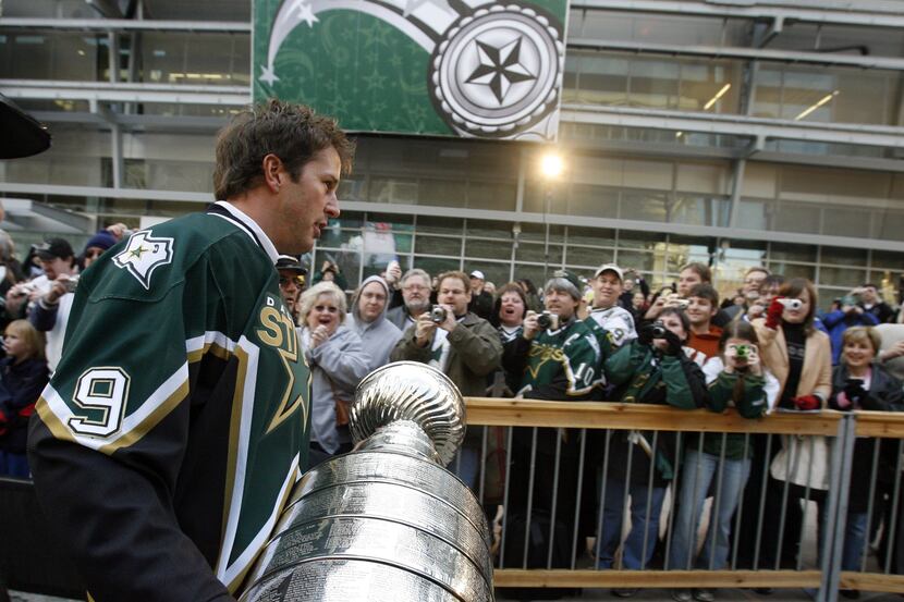 2007 NHL All-Star Game, American Airlines Center in Dallas -- Mike Modano carries the...