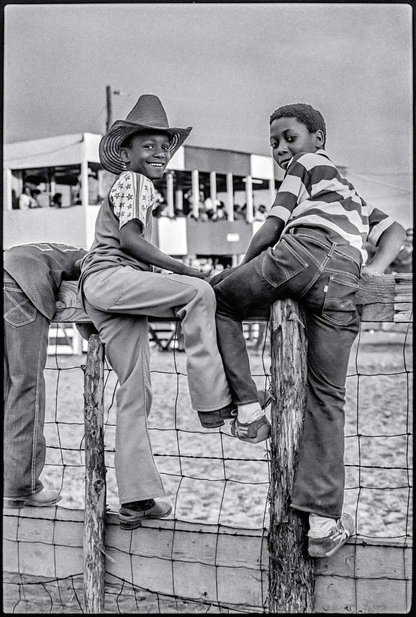 Two kids at a Juneteenth rodeo at the Diamond L Arena near Houston.