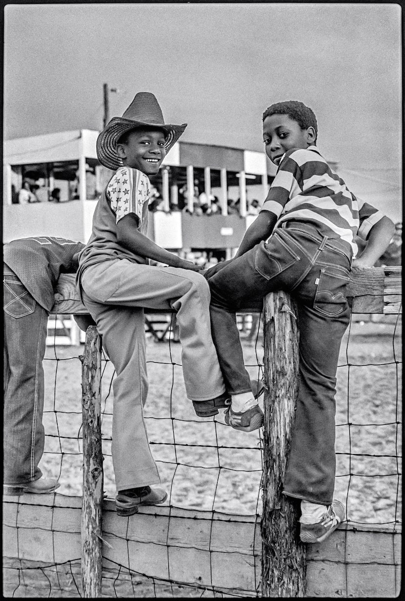 Two kids at a Juneteenth rodeo at the Diamond L Arena near Houston.