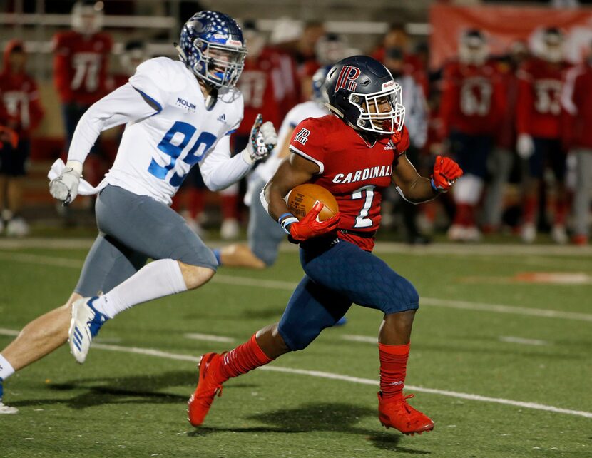 John Paul II's Myles Parker (2) runs a kick back as he is chased by Nolan's Kaleb James (99)...