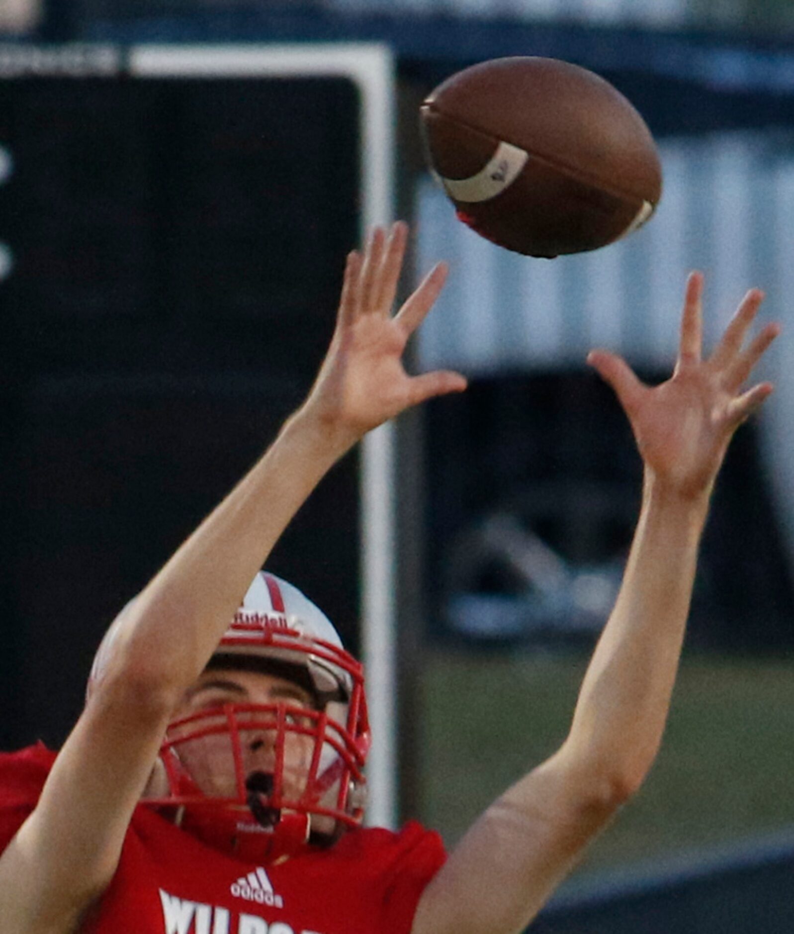 Dallas Woodrow Wilson punter Brendan Prather (48) reaches to pull down a high snap before...