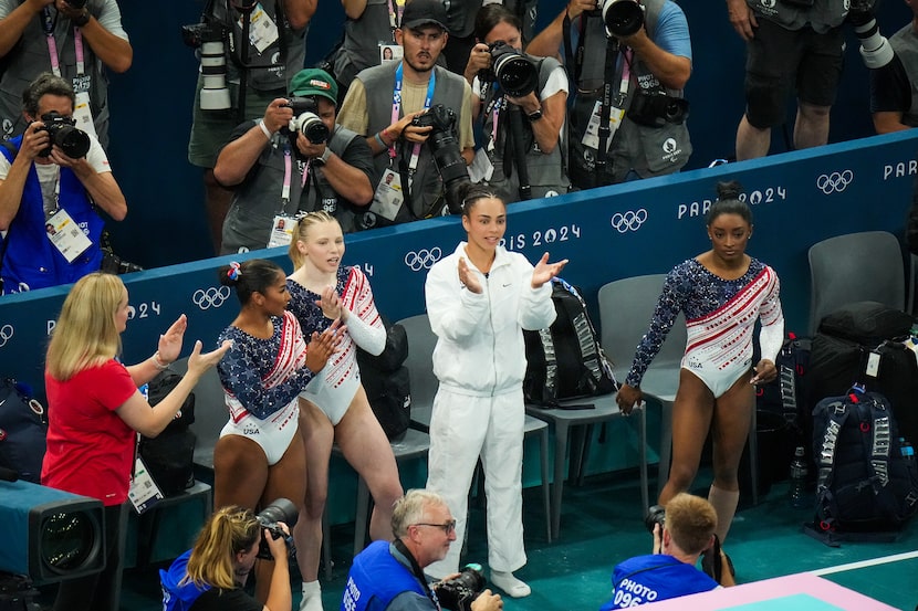 From left, coach Cecile Landi, Jordan Chiles, Jade Carey, Hezly Rivera and Simone Biles...