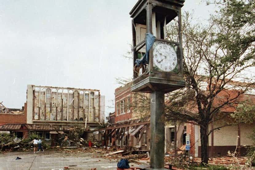 The Lancaster town square  clock was left standing but in shambles after a tornado cut a...