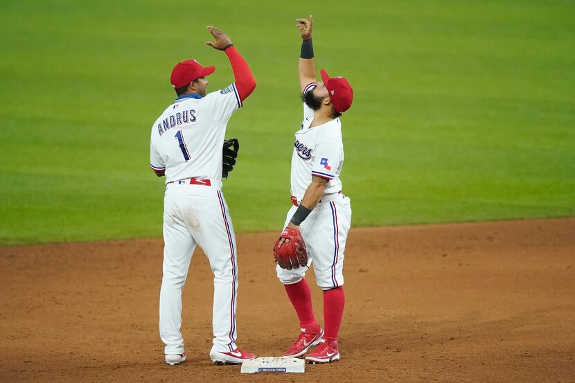Texas Rangers shortstop Elvis Andrus and second baseman Rougned Odor celebrate after a 2-0...