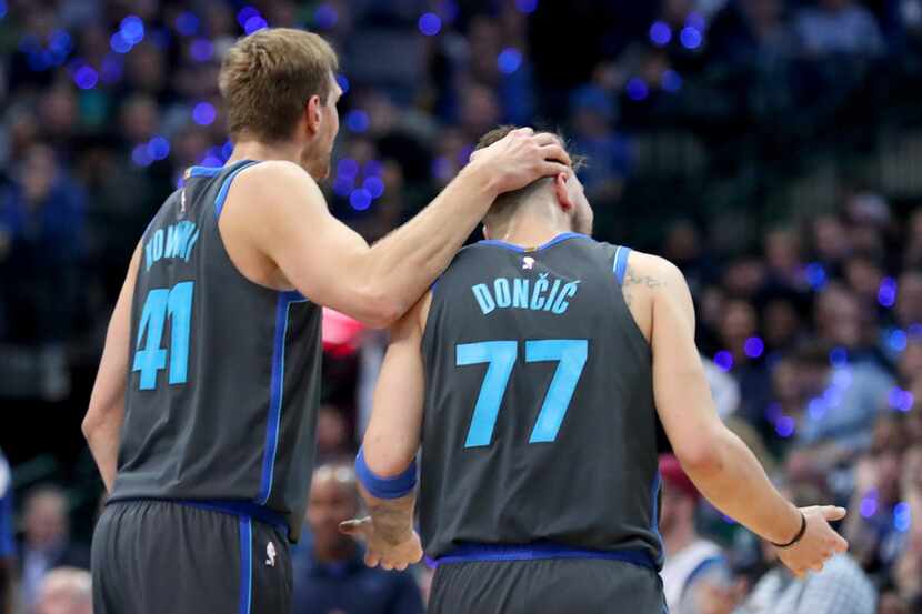 DALLAS, TEXAS - JANUARY 16: Dirk Nowitzki #41 of the Dallas Mavericks celebrates with Luka...