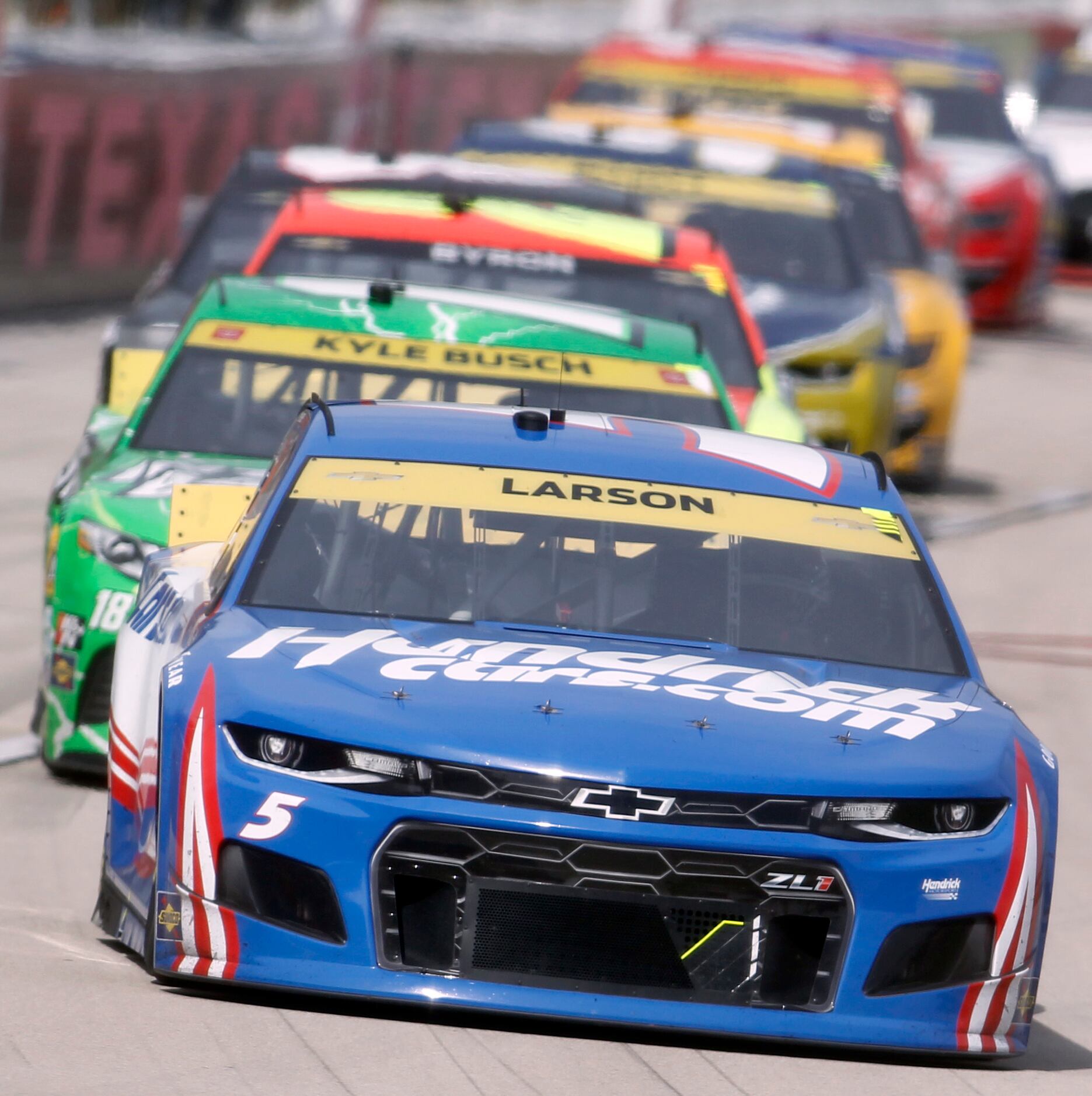 Driver Kyle Larson leads the pack coming out of a re-start in the 2nd stage of the race from...