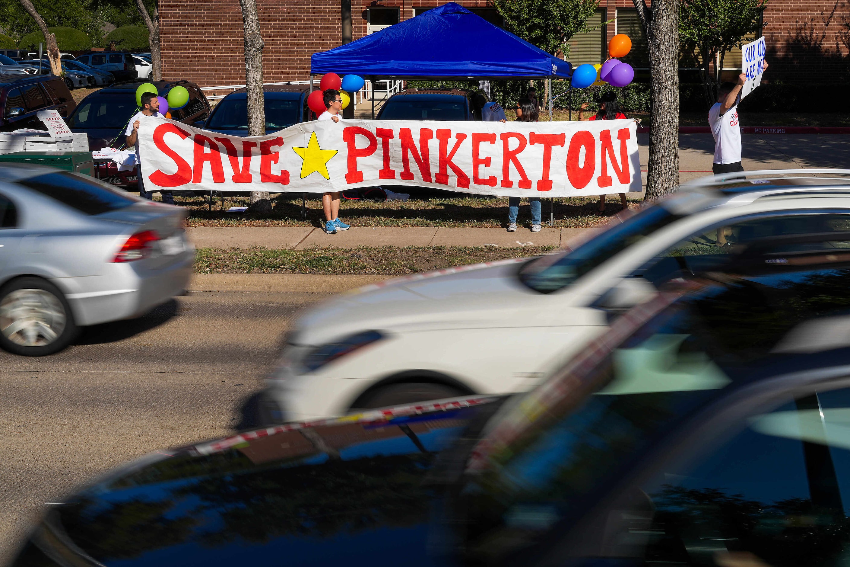 Families protest outside the Coppell ISD administration building on Monday, Sept. 30, 2024,...