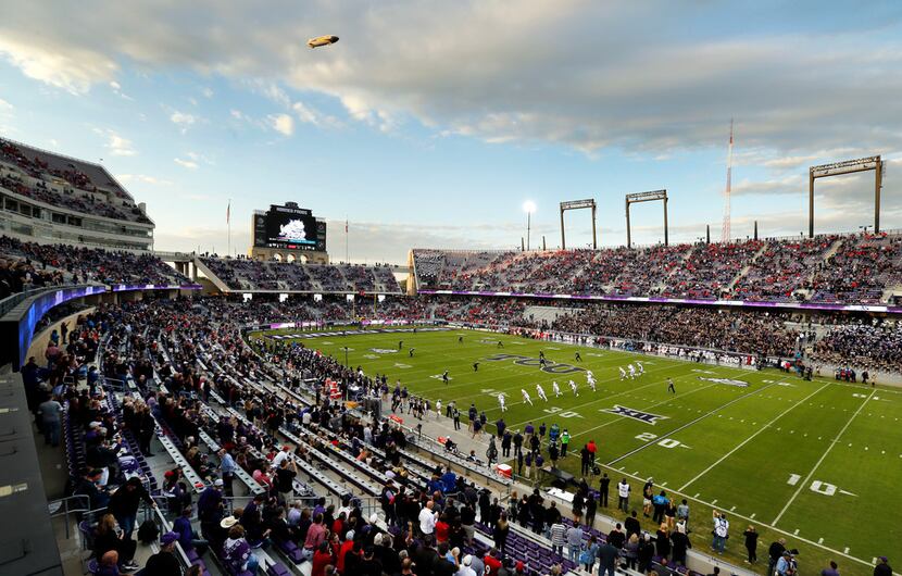 The Goodyear blimp hovers near Amon G. Carter Stadium in Fort Worth as the Texas Tech Red...