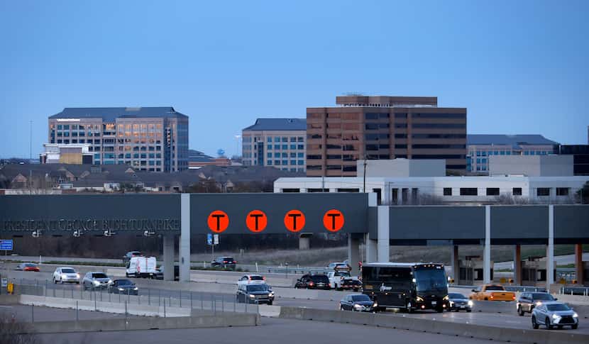Evening traffic crosses under the President George Bush Turnpike station (NTTA SH 161) in...
