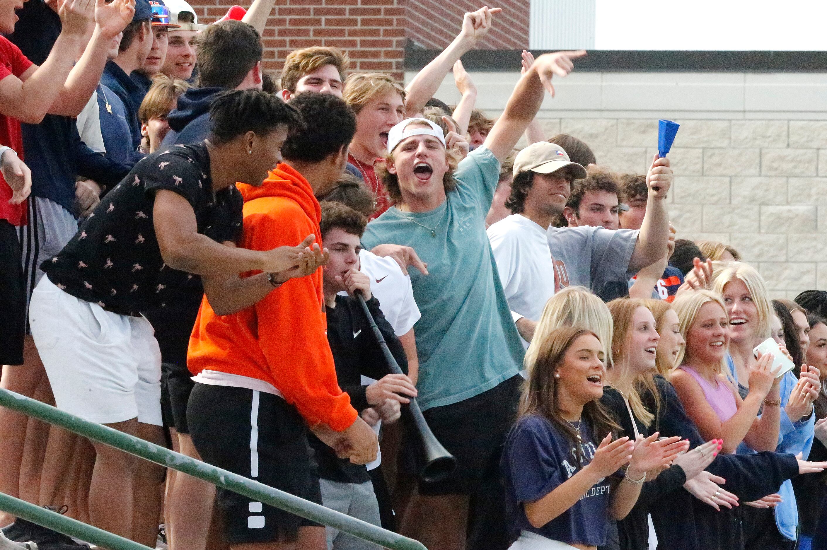 The Wakeland student section celebrates a goal by midfielder McKenna Jenkins during the...