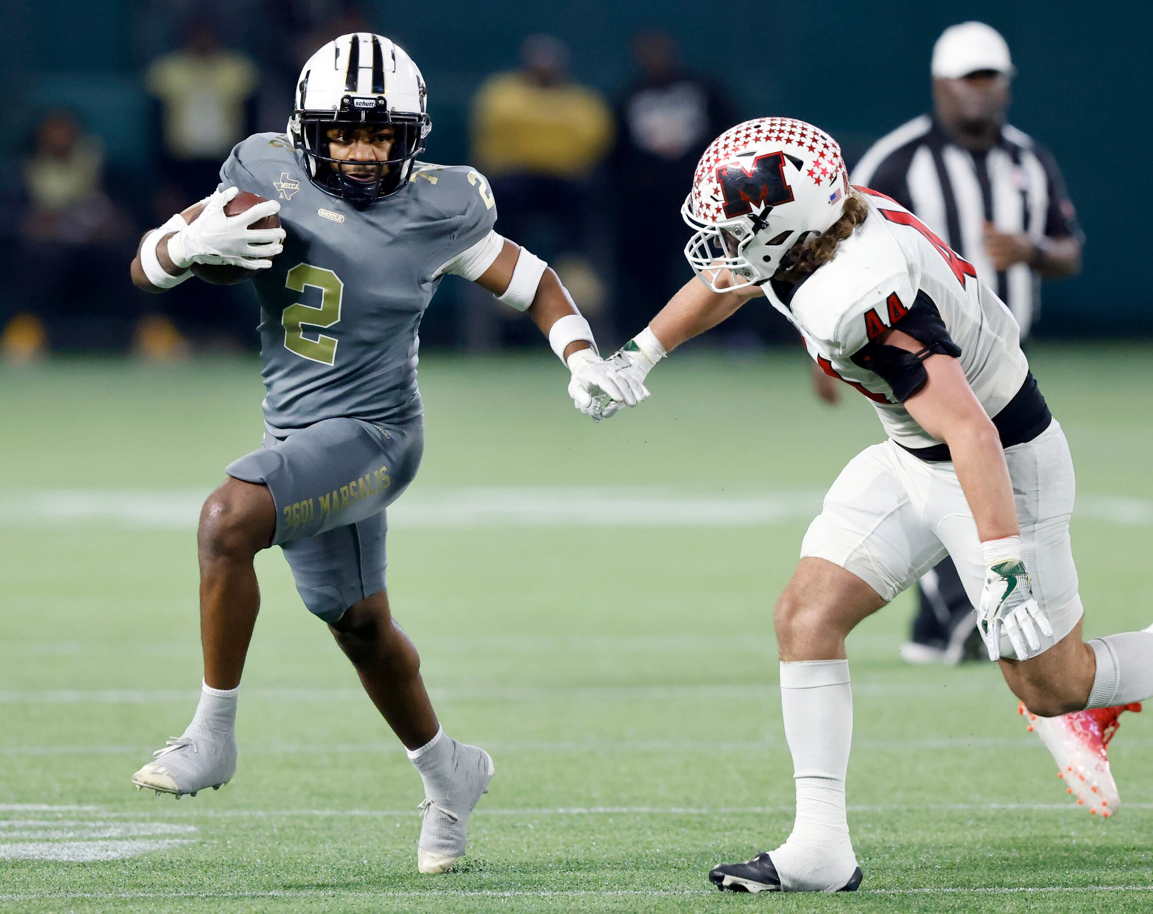 South Oak Cliff running back Tedrcik Williams (2) keeps Melissa linebacker Alex Secreto (44)...