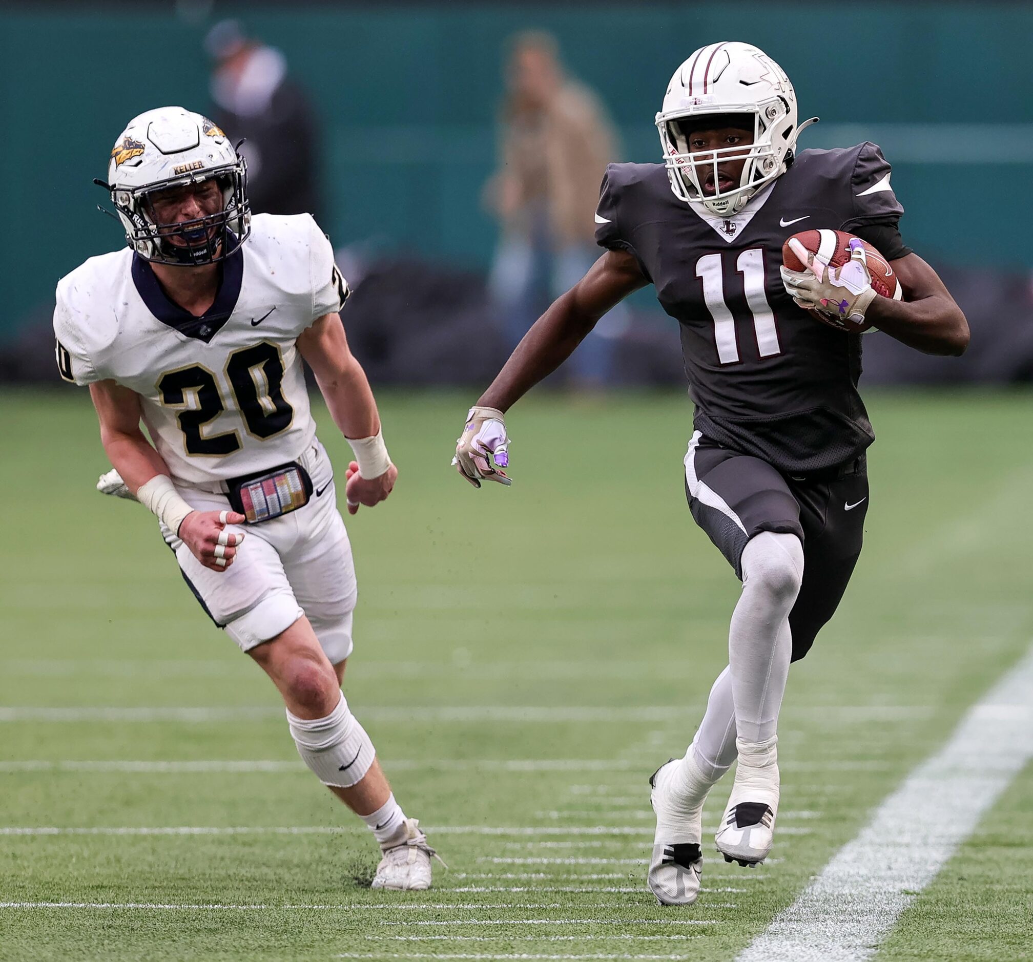 Lewisville running back Xavier Lewis (11) comes up with a big gain against Keller defensive...