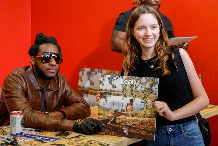 Leon Bridges poses for a photo with 15-year-old Emerson Whiteneck of Corpus Christi at an...