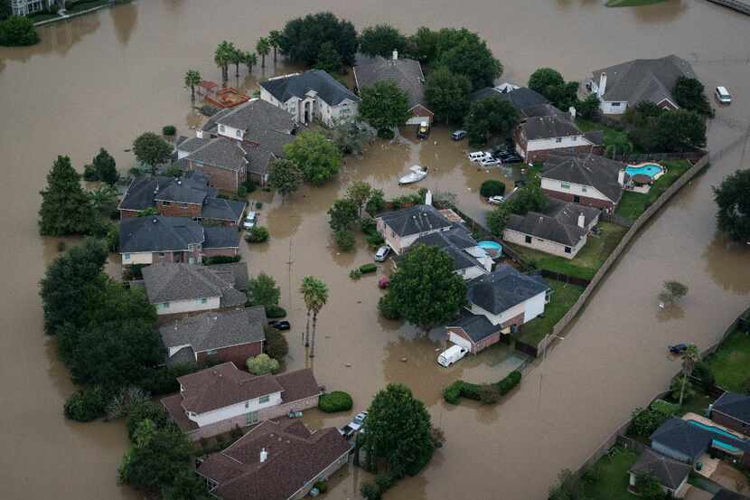 Flood water surrounds houses and apartment complexes in West Houston. 