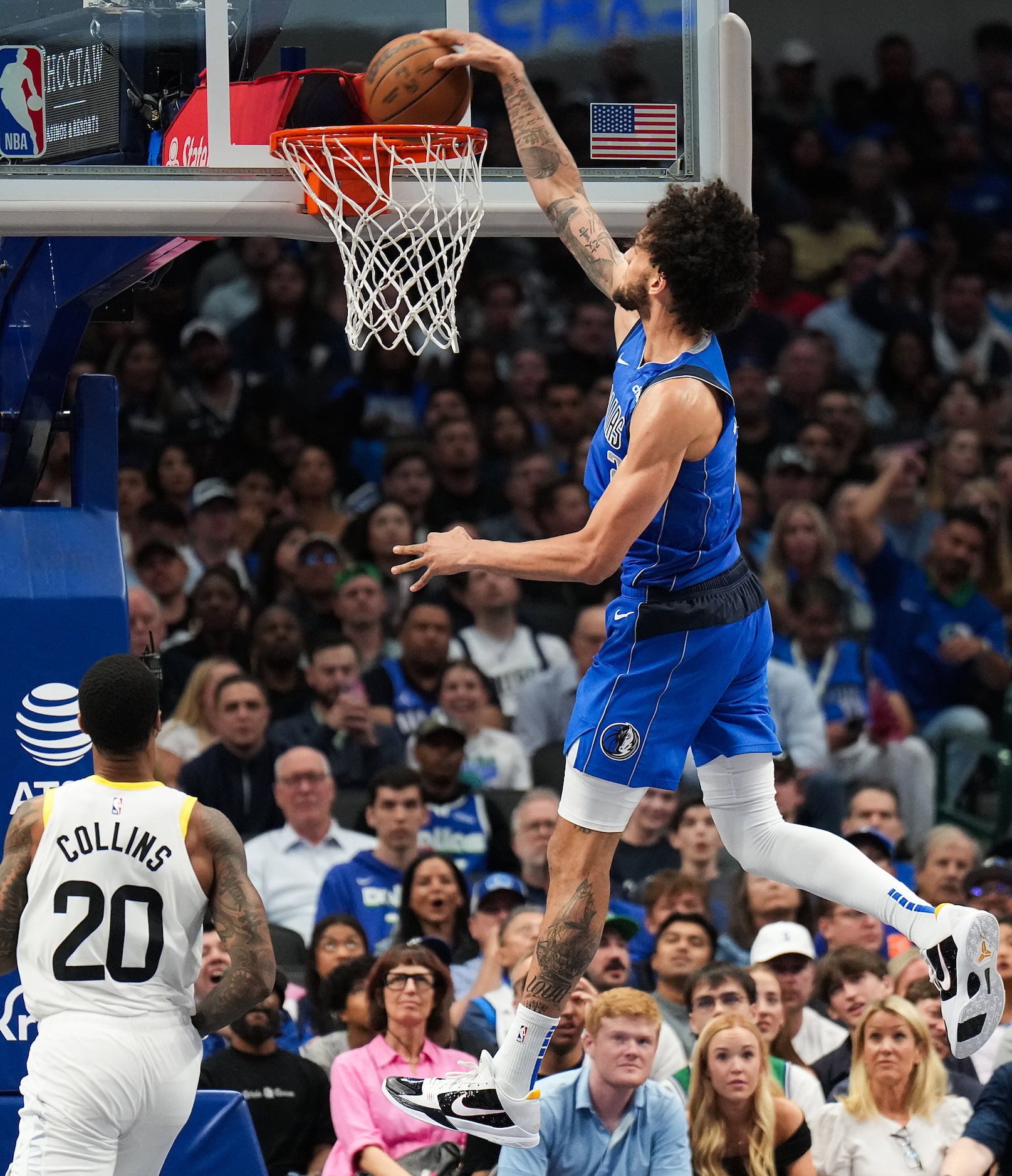 Dallas Mavericks center Dereck Lively II (2) dunks the ball past Utah Jazz forward John...