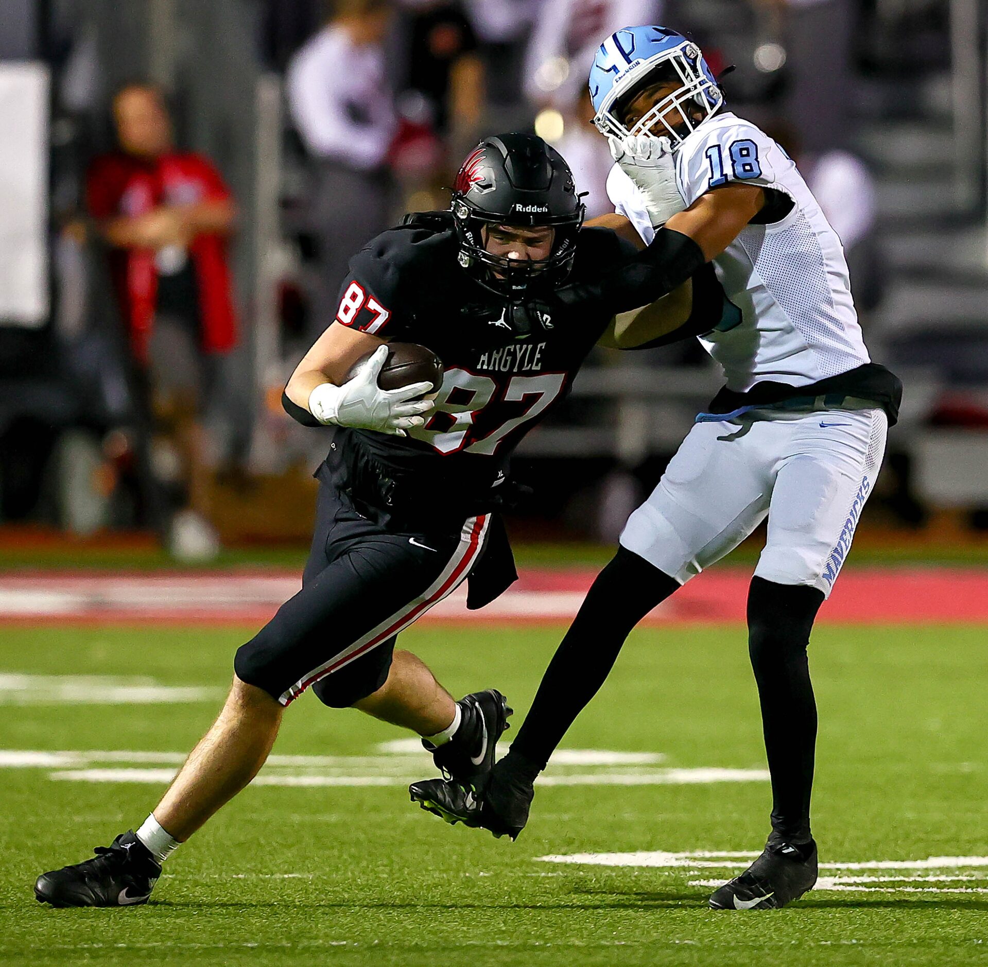 Argyle tight end Hunter McFaul (87) tries to get loose from Frisco Emerson defensive back...