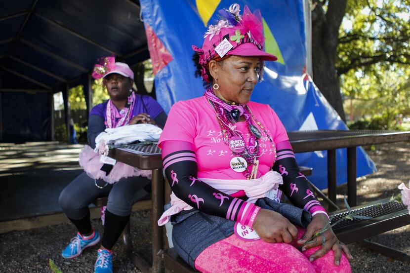 Breast cancer survivor Lucinda Johnson (foreground) and her walking teammate Brenda Simmons,...