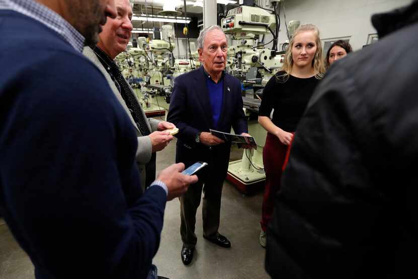 Former New York City Mayor Michael Bloomberg (center) talks with students in the Wind...