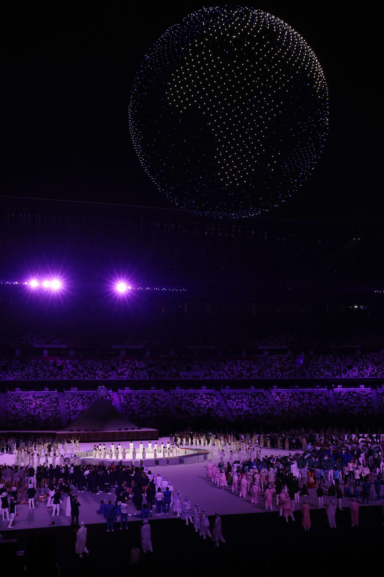 Drones make a formation during the opening ceremony for the postponed 2020 Tokyo Olympics at...