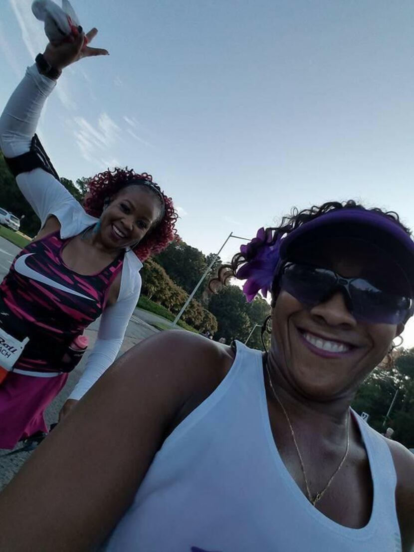 Daphyne Jackson (left) and one of her running friends, Scymentress Williams, celebrate...