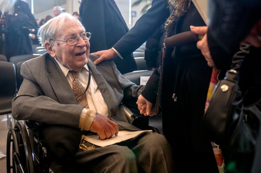 Ghost Army member Seymour Nussenbaum of Monroe Township, N.J, talks with well-wishers after...