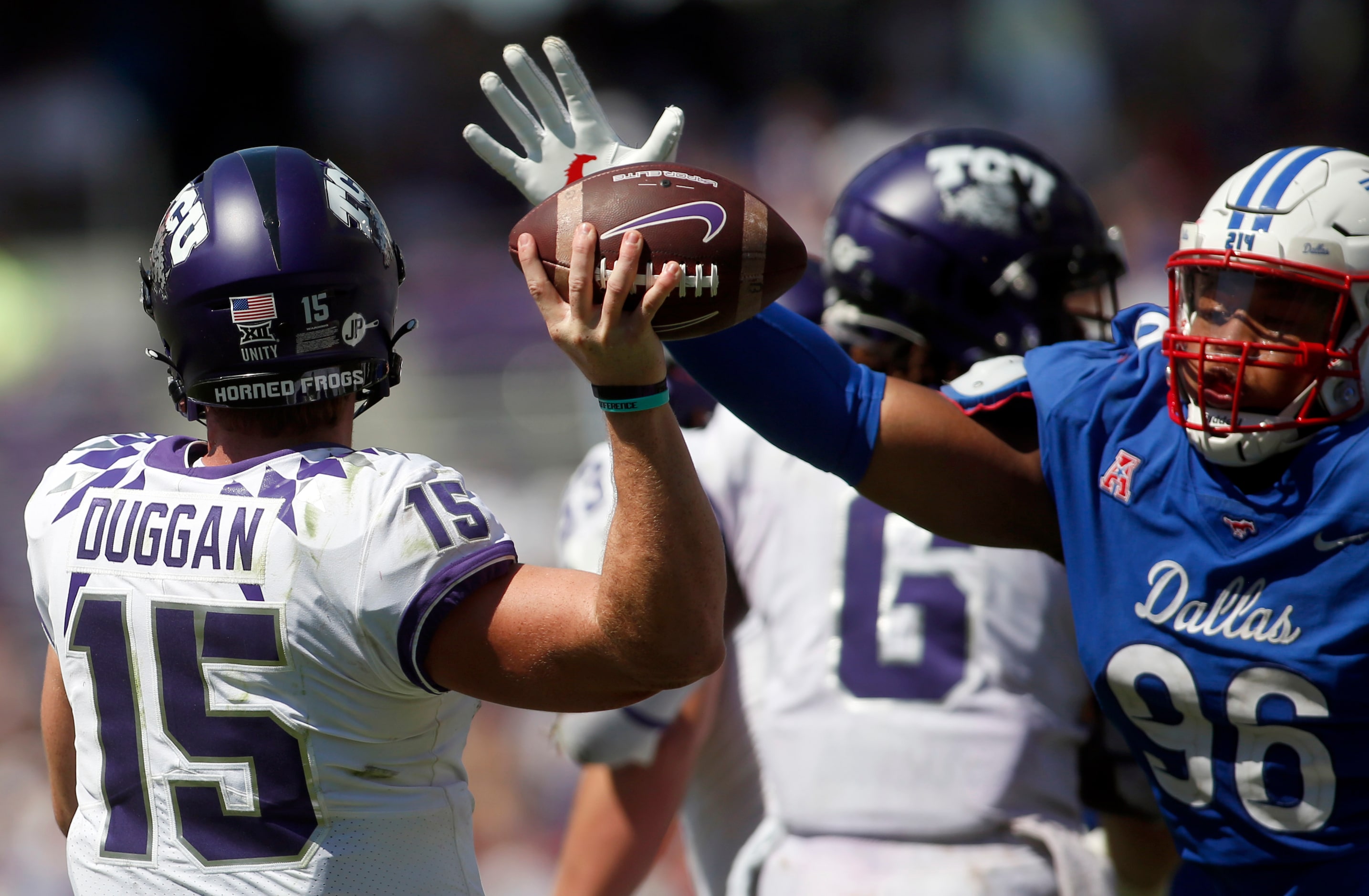 TCU quarterback Max Duggan (15) narrowly missed getting this pass blocked by SMU defensive...