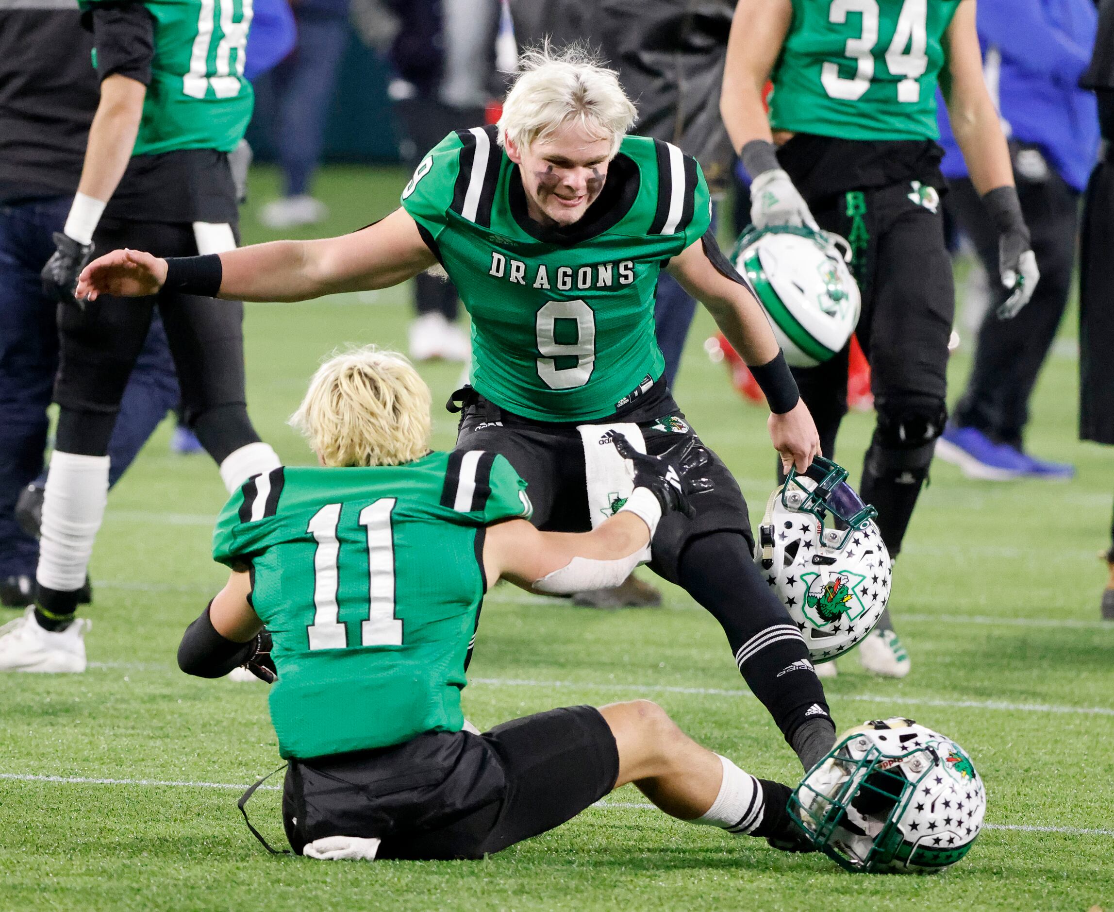 Southlake’s Hunter Holden (9) and Josh Spaeth (11) celebrate their victory over Duncanville...