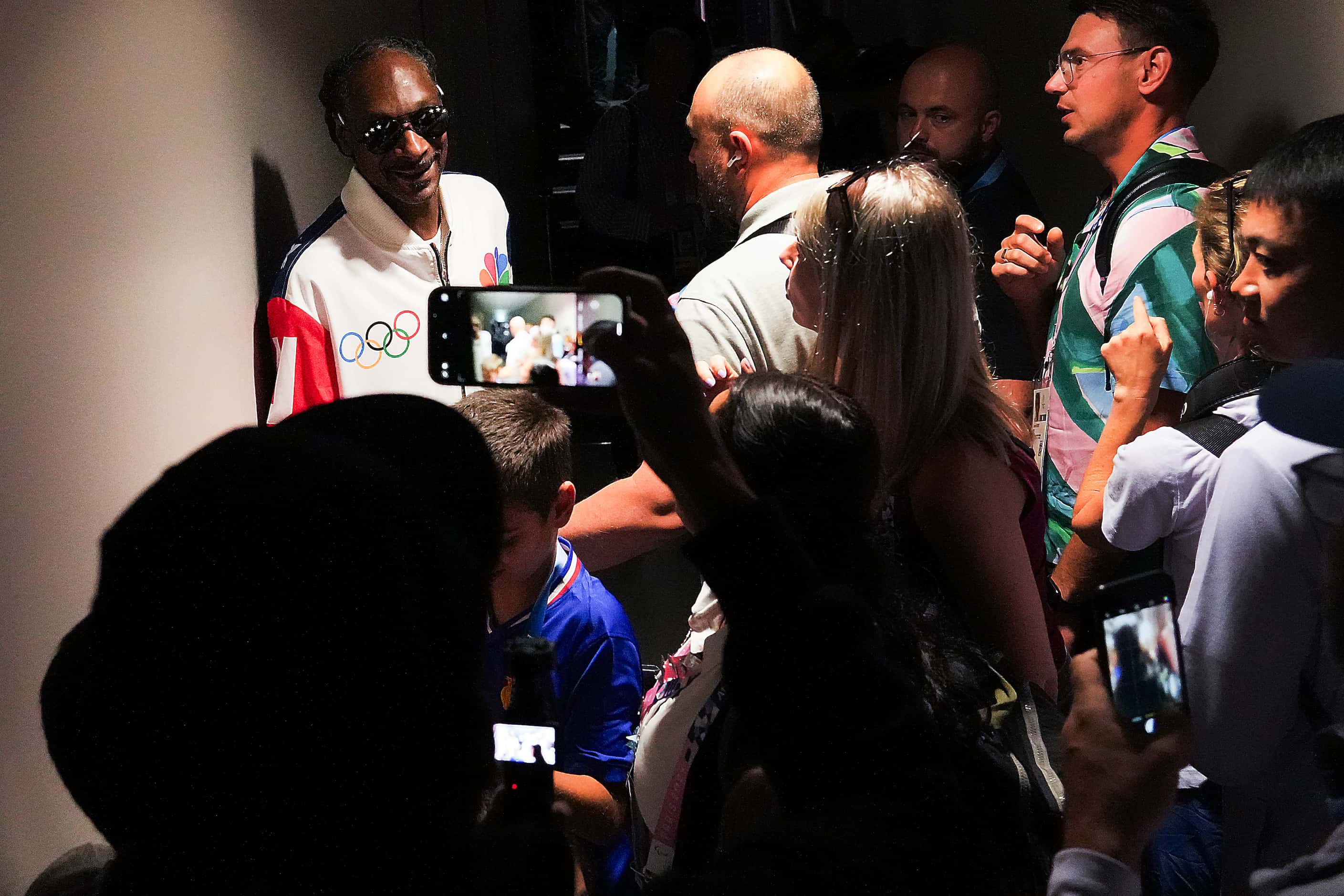 Rapper Snoop Dogg poses for photos after watching women’s gymnastics qualifying at the 2024...
