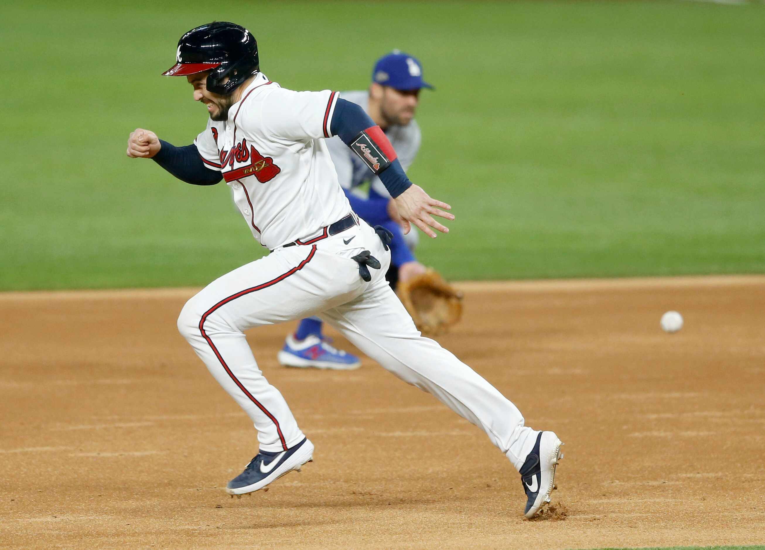 Atlanta Braves catcher Travis d'Arnaud (16) runs to second base as Los Angeles Dodgers...