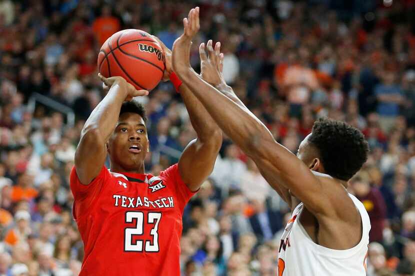 Texas Tech's Jarrett Culver (23) shoots over Virginia's De'Andre Hunter (12) during the...